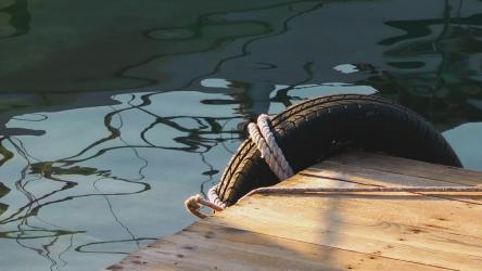 Tied rim on the edge of a pier, close up view[]