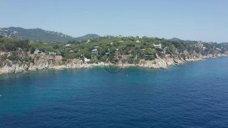 Beautiful blue ocean leading to a rough coastline[]