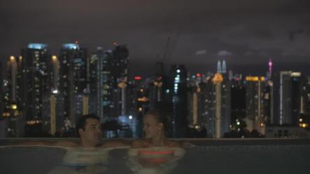 Couple talking in an infinity pool[]
