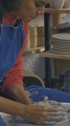 Two girls in a pottery workshop making clay vases[免费商用竖屏]