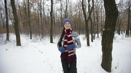 Woman exercising in the forest in winter[]