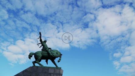Floating clouds above a statue[]