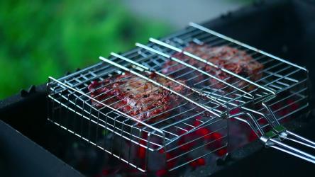 Cooking meat in the grill, close up[]