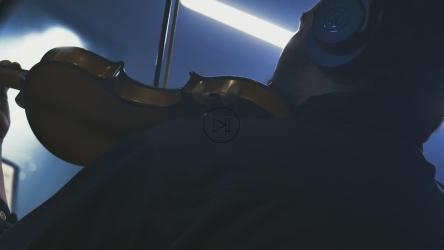 Violinist playing with sheet music in a recording studio[4K免费商用]