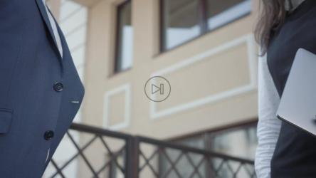 Closeup of business people shaking hands outside[]