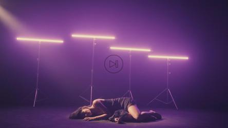 Girl dancing on the floor illuminated by neon lights[免费商用]