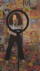 Girl recording a video on a background of cereal boxes[免费商用竖屏]