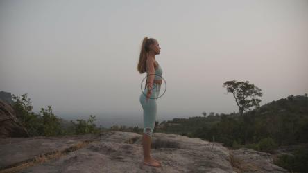 Young woman doing yoga in the mountains[]