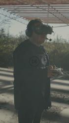 Man flying a remote controlled drone outdoors[免费商用竖屏]