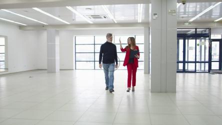 Business woman walking through a new office space[]