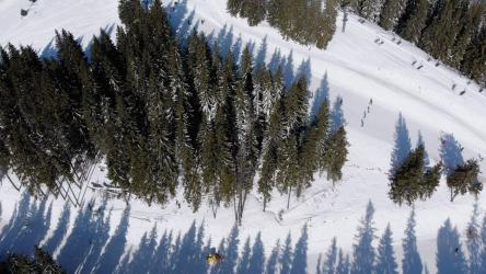 Flying over at ski track in the mountain[]