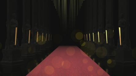 Red carpet between rows of black columns[]