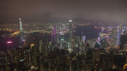City of huge buildings with a river at night[]