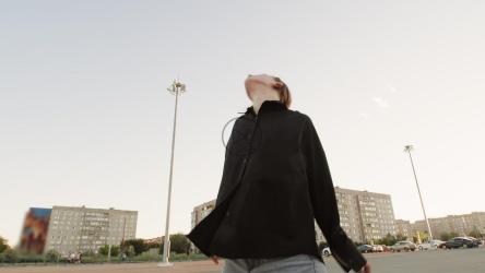 Contemporary dancer practicing her routine in the city[]