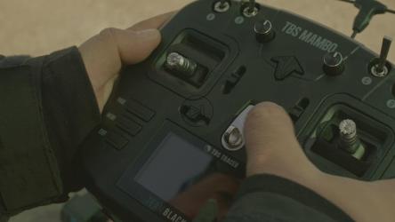 Turning on a large remote control to fly a drone[免费商用]