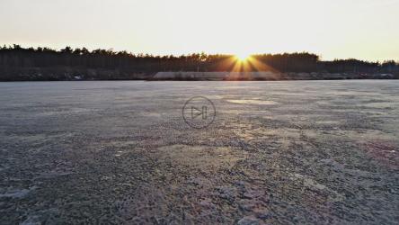 Aerial walk over a frozen lake[4K]