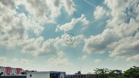 Gentle blue sky above a small city[4K]