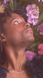 Face of an LGBTQ boy surrounded by flowers[免费商用竖屏]