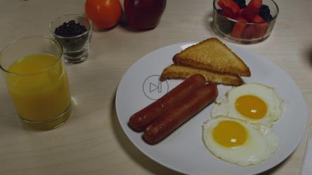 Sausages with egg and fruits[]