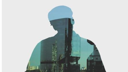 公司大楼和一个人双重曝光 Double Exposure:在一个阳光明媚的日子里，在一个男人的剪影里可以看到一座城市的两栋公司大楼。