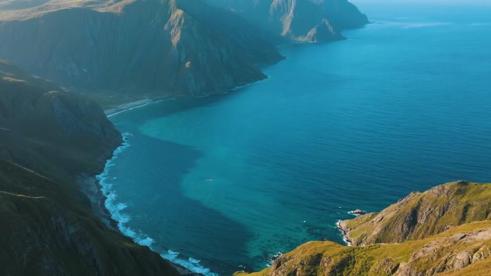 航拍蓝色海水环绕山谷绝美景观素材
